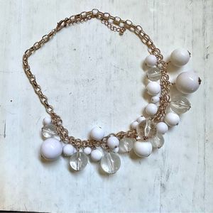 White clear and gold tone beaded necklace